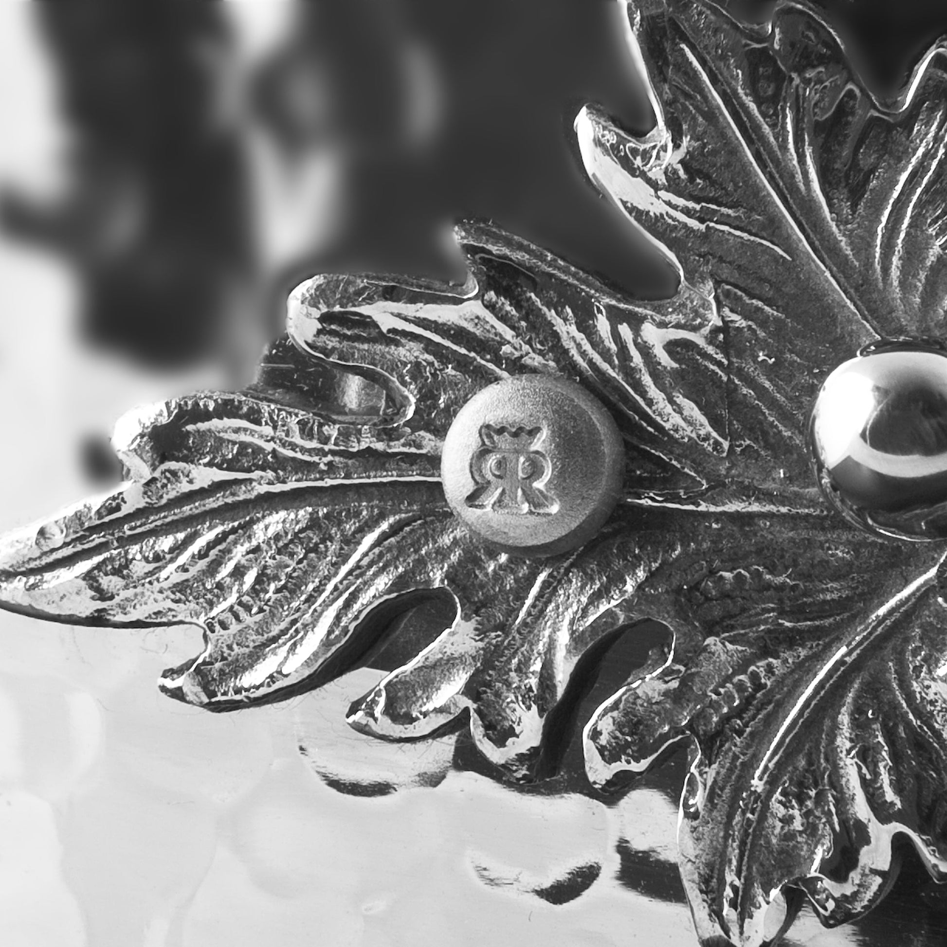 Beautiful stainless steel handle decorated with delicate leaves on Opus Prima cookware by Ruffoni