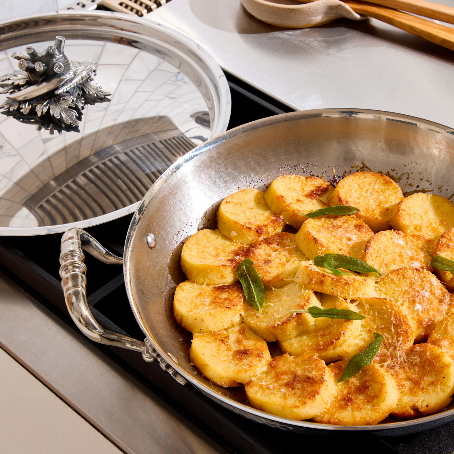 Gnocchi alla romana prepared and served in Ruffoni Opus Prima hammered clad stainless steel gratin with decorated silver-plated lid knob finial