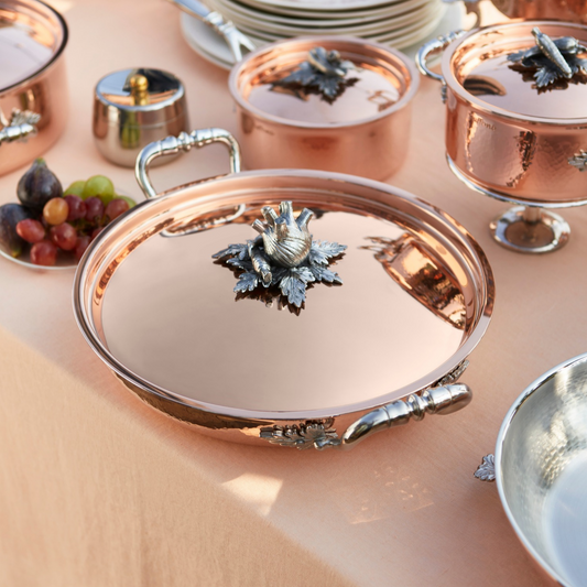 Ruffoni Opus Cupra copper Serving Frying Pan on a salmon pink backgroun