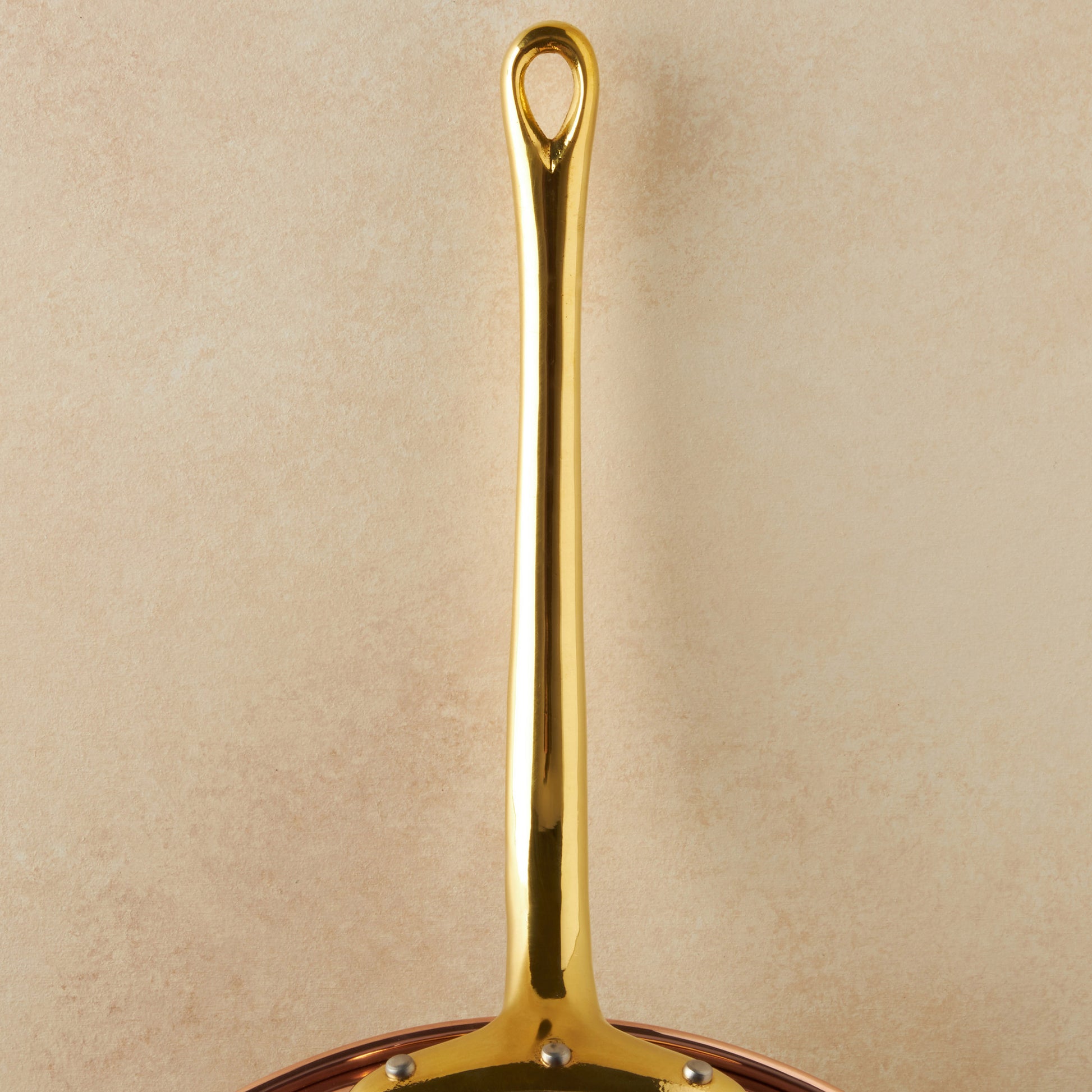 Beautiful bronze long stick handle  on Historia cookware by Ruffoni