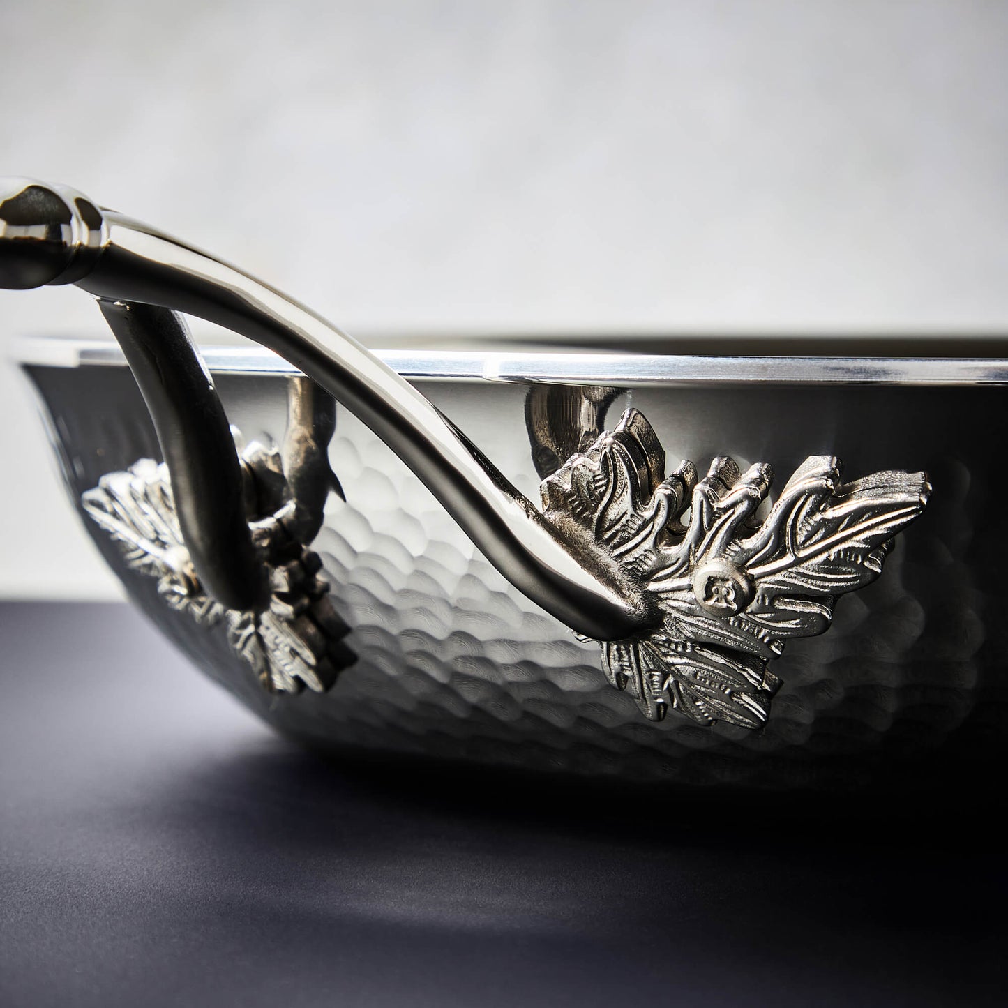 Details of the Opus Prima hammered clad stainless steel pan with decorated silver-plated from Ruffoni