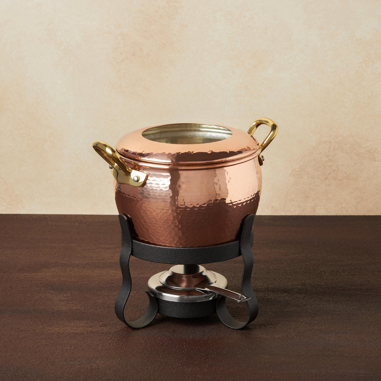 Hammered copper Fondue Michelle Set from the Ruffoni Historia collection. Lined with high purity tin applied by hand over fire and adorned with bronze handles.