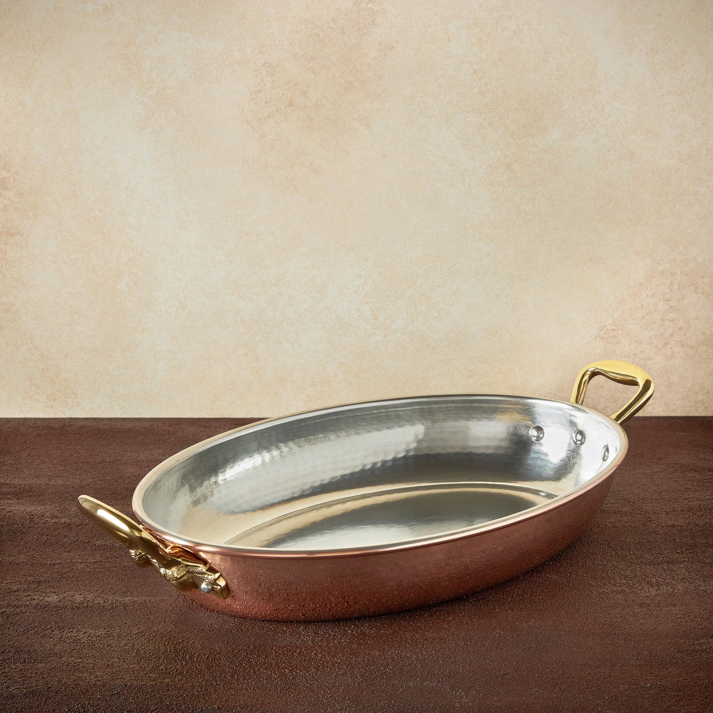 Hammered copper 14" Oval Gratin lined with high purity tin applied by hand over fire and bronze handles, from Ruffoni Historia collection
