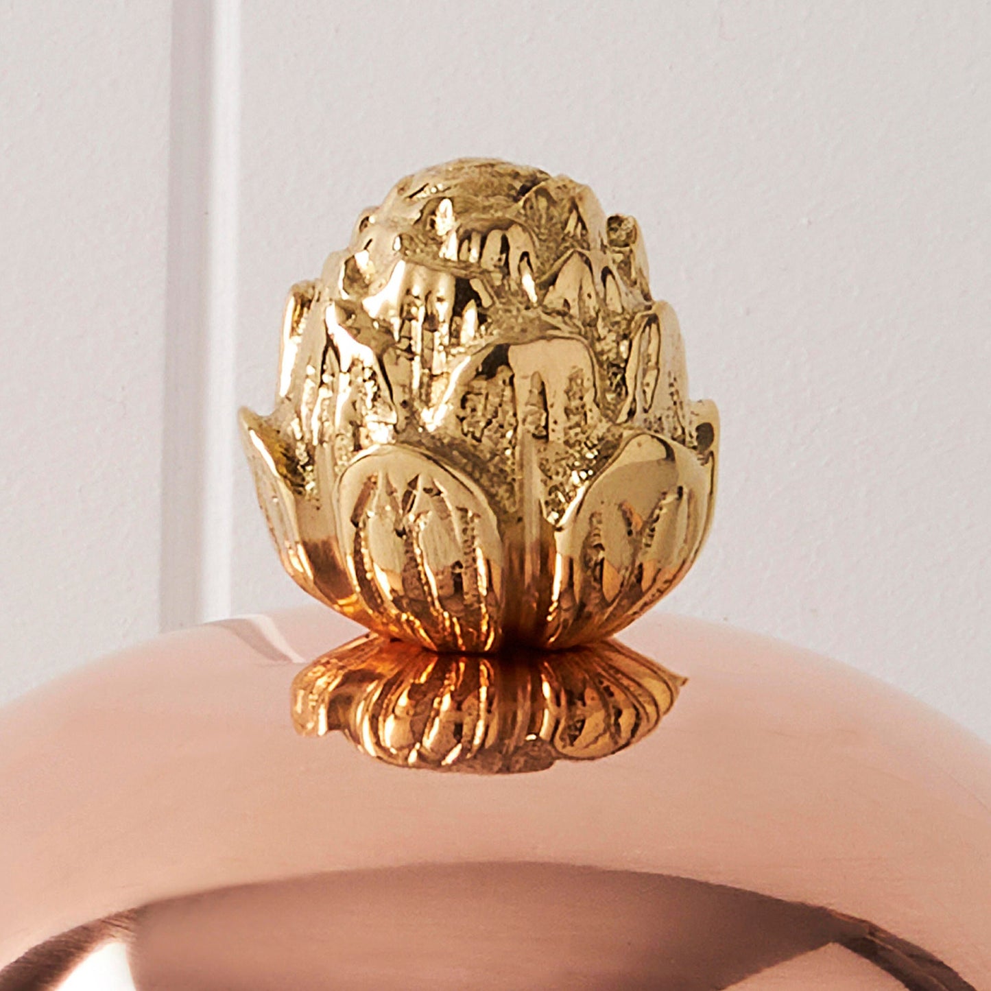 copper lid with bronze artichoke finial