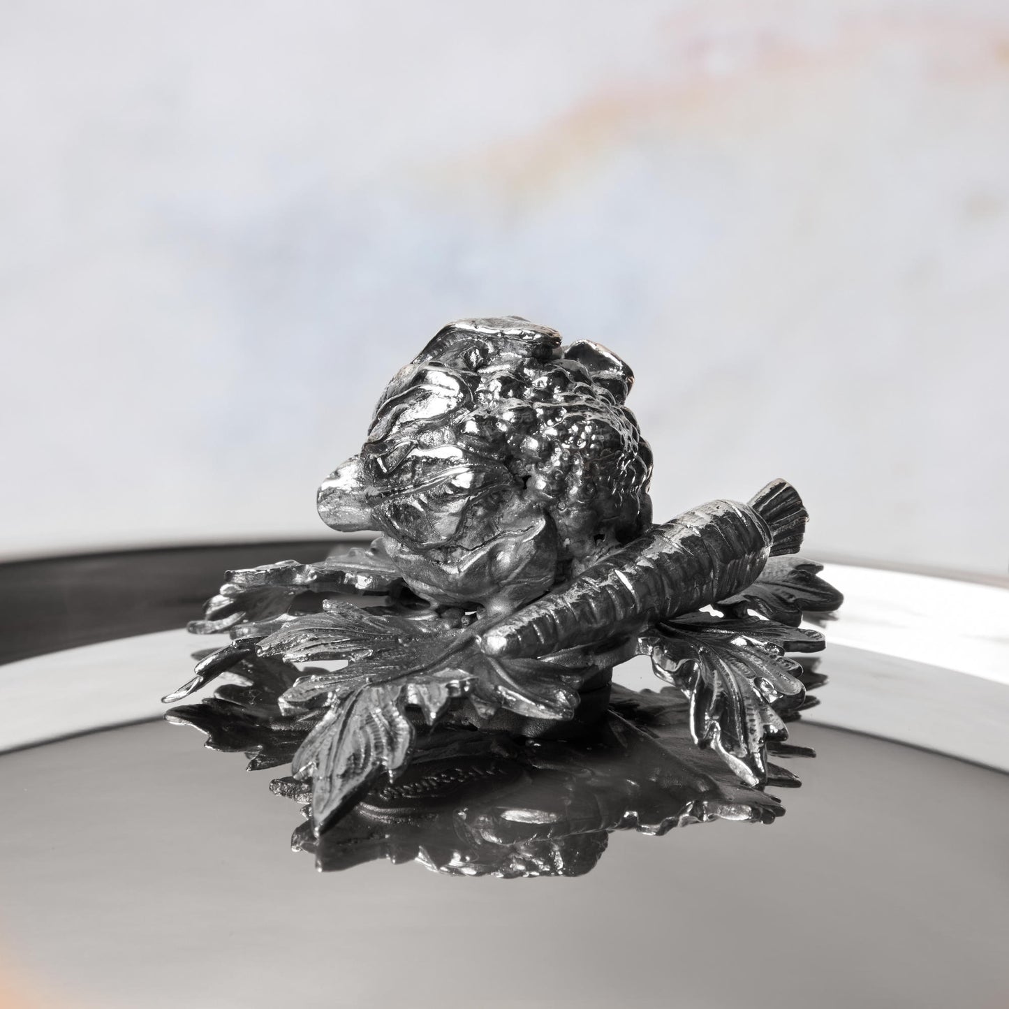 Decorated knob finial representing cauliflower and carrot, cast in solid bronze and silver plated, on Opus Prima stainless steel lid by Ruffoni