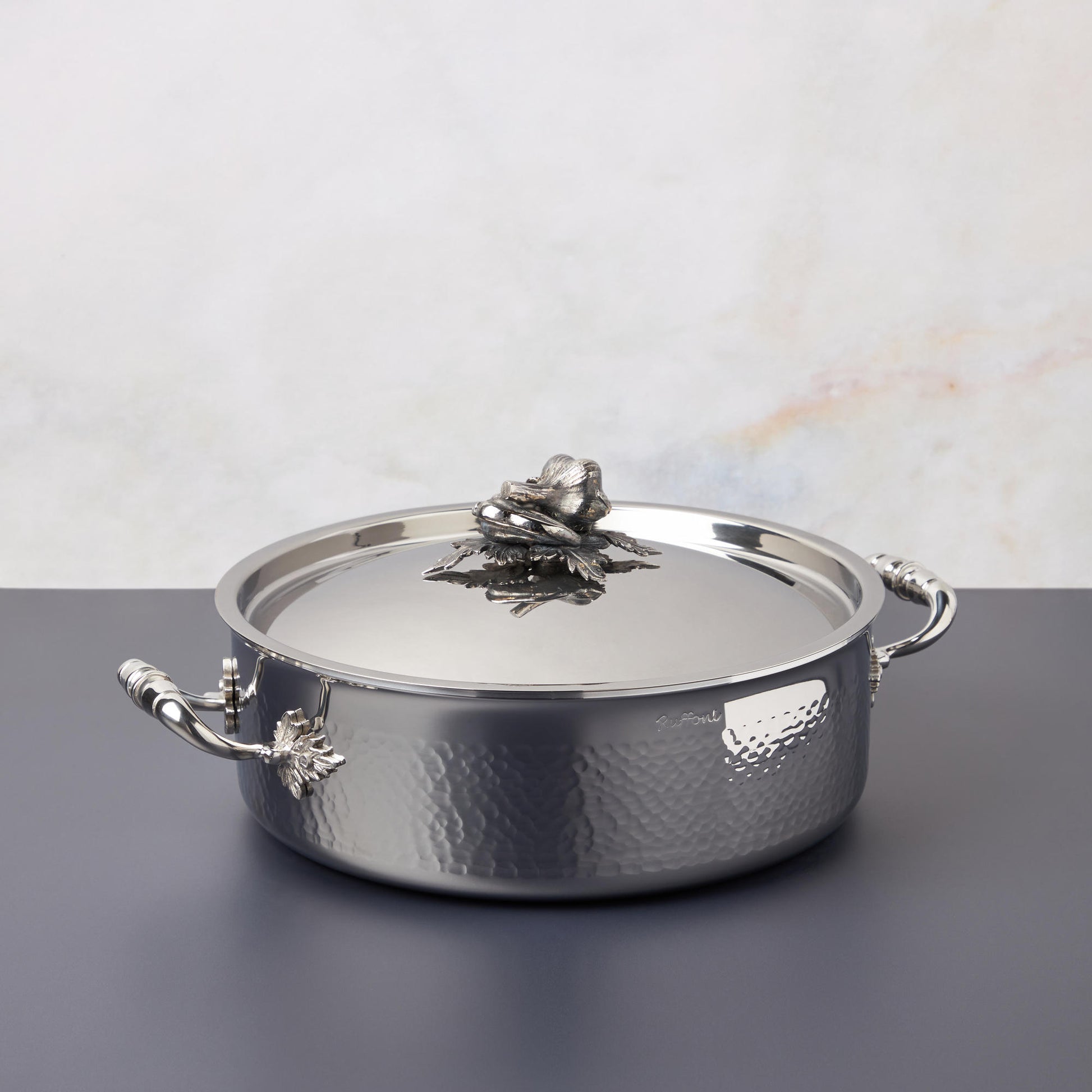 Opus Prima braiser in hammered clad stainless steel with decorated lid and handles by Ruffoni