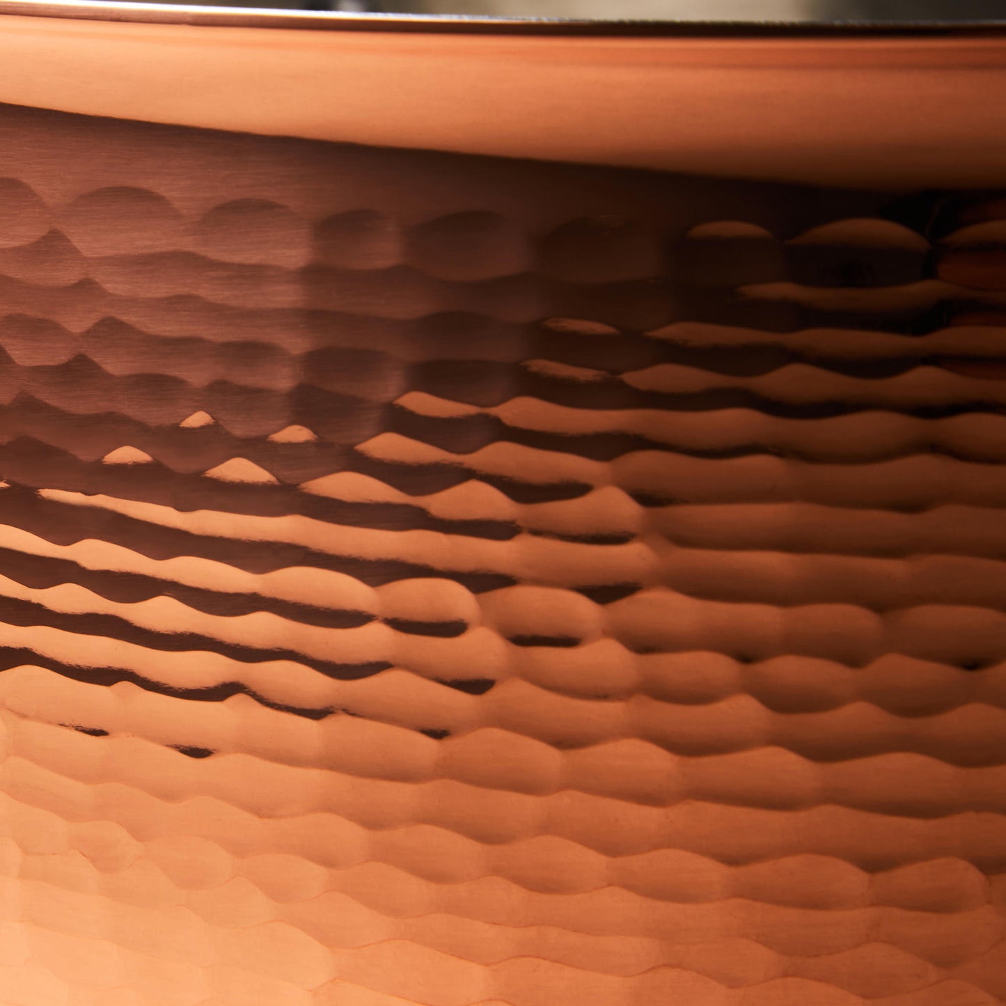 Hammering increases strength and beauty of copper clad with stainless steel stockpot from Ruffoni