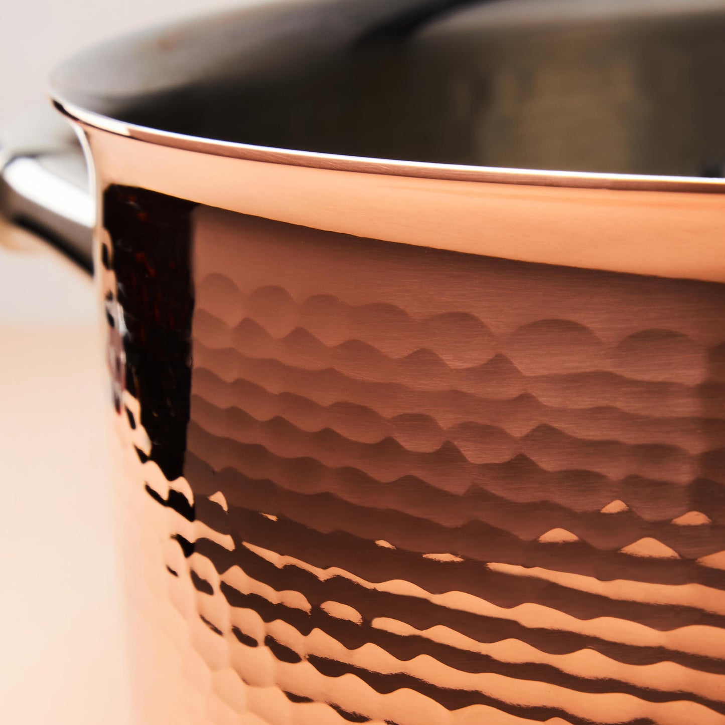 Hammering increases strength and beauty of copper clad with stainless steel braiser from Ruffoni