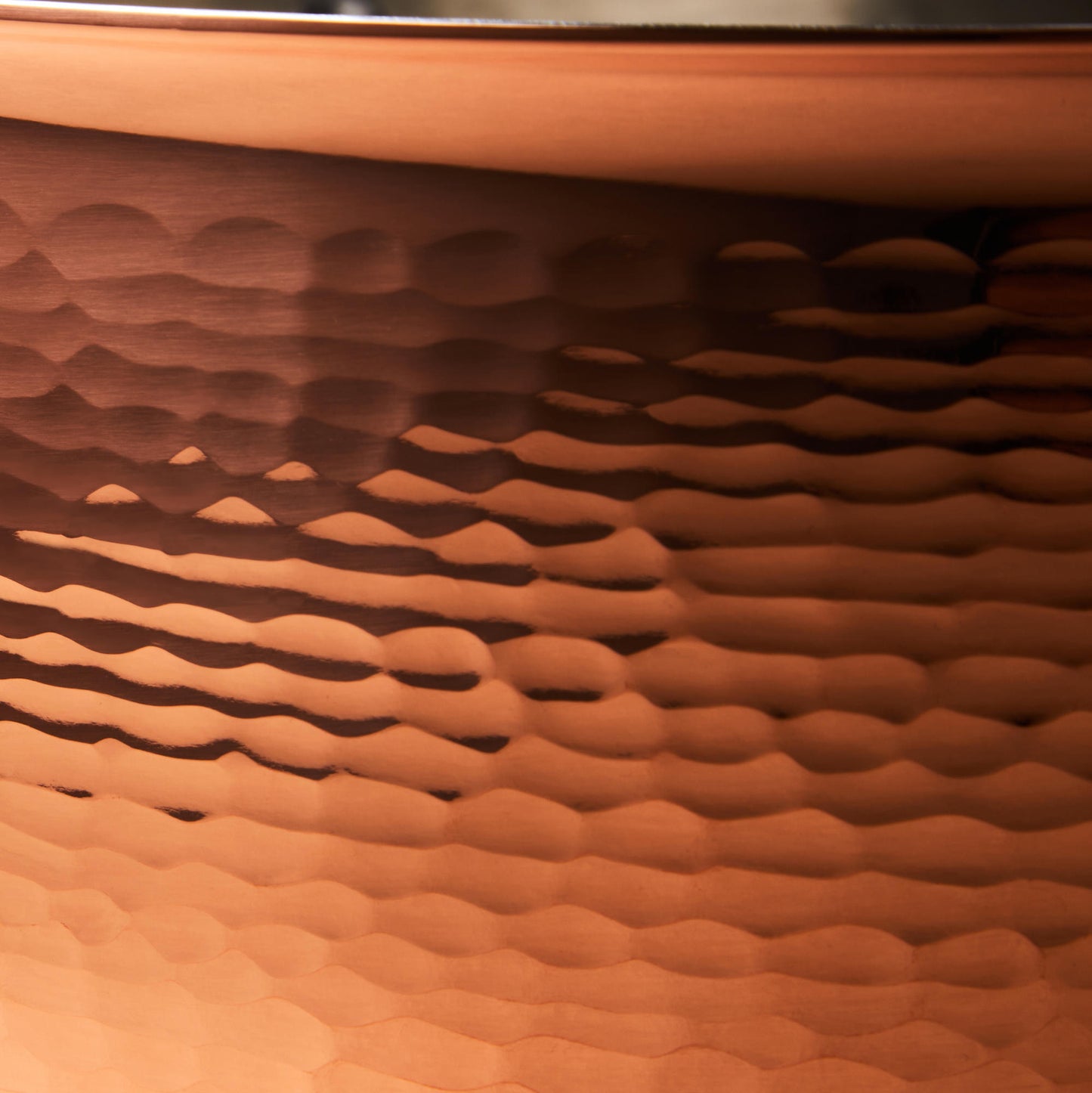 Hammering increases strength and beauty of copper clad with stainless steel sauté from Ruffoni