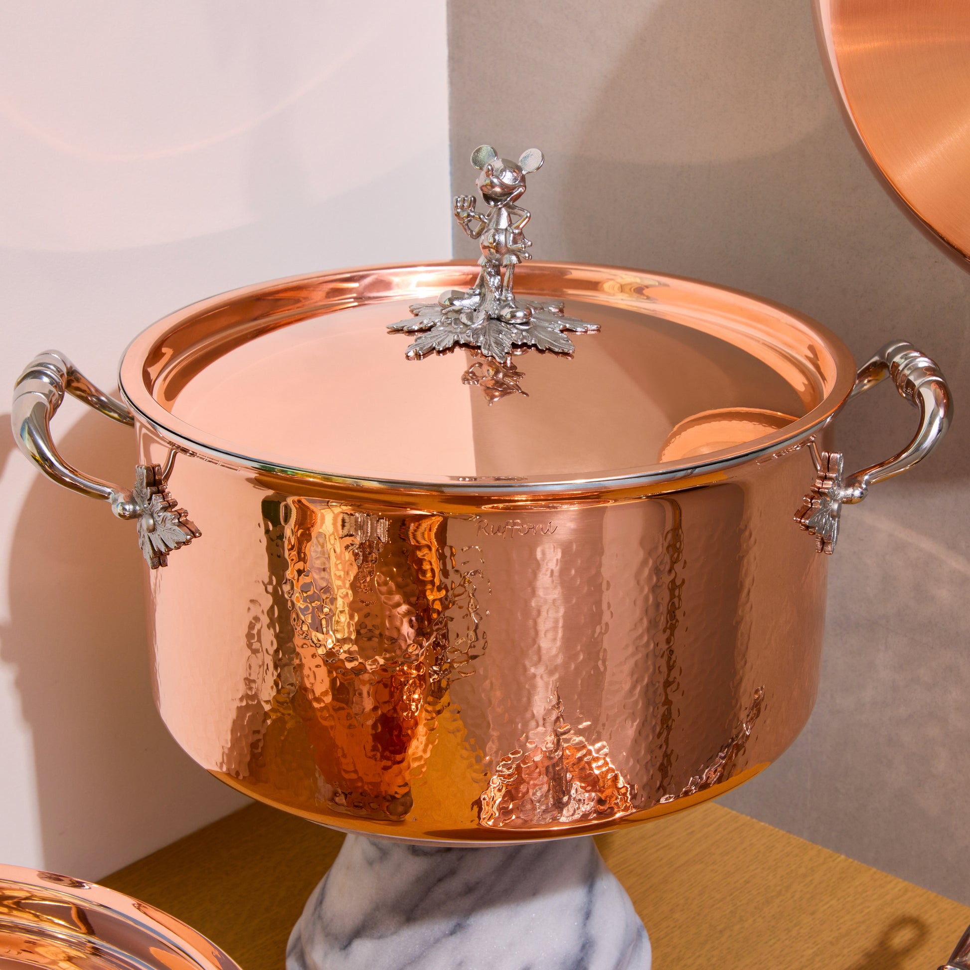 Disney x Ruffoni Opus Cupra 8qt stockpot hammered copper with special edition Disney-inspired knobs in stainless steel featuring Mickey Mouse, by Ruffoni
