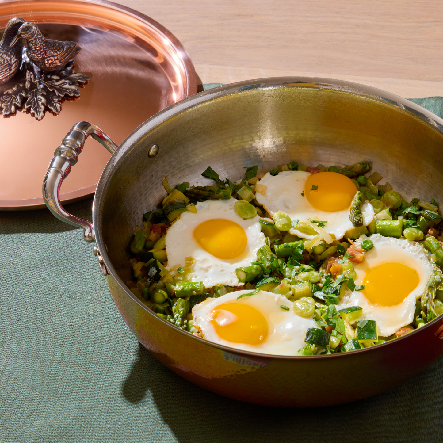 Green Shakshuka in an Opus Cupra hammered copper pot with a stainless steel lining and a silver-plated lid knob finial from Ruffoni.