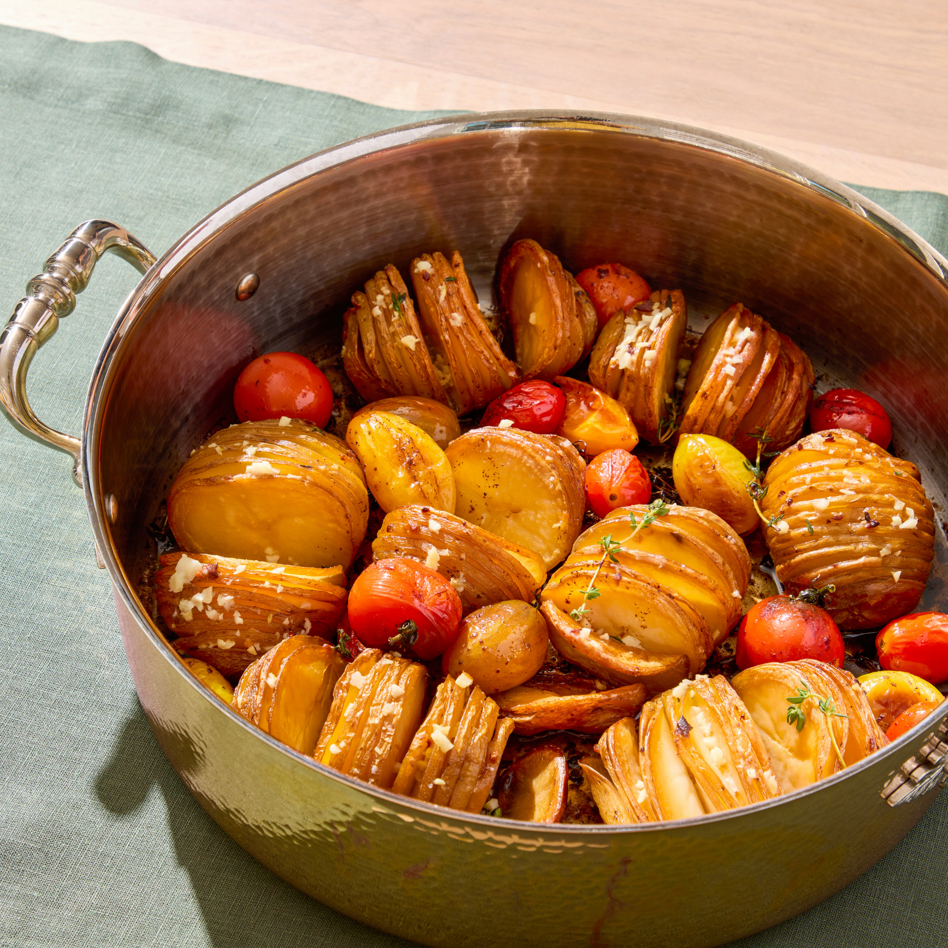 Hasselback Potatoes in an Opus Cupra braiser hammered copper with stainless steel lining and decorated silver-plated lid knob finial from Ruffoni.