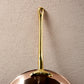 Long brass stick handle riveted to a Ruffoni Olivia Cupra copper frying pan