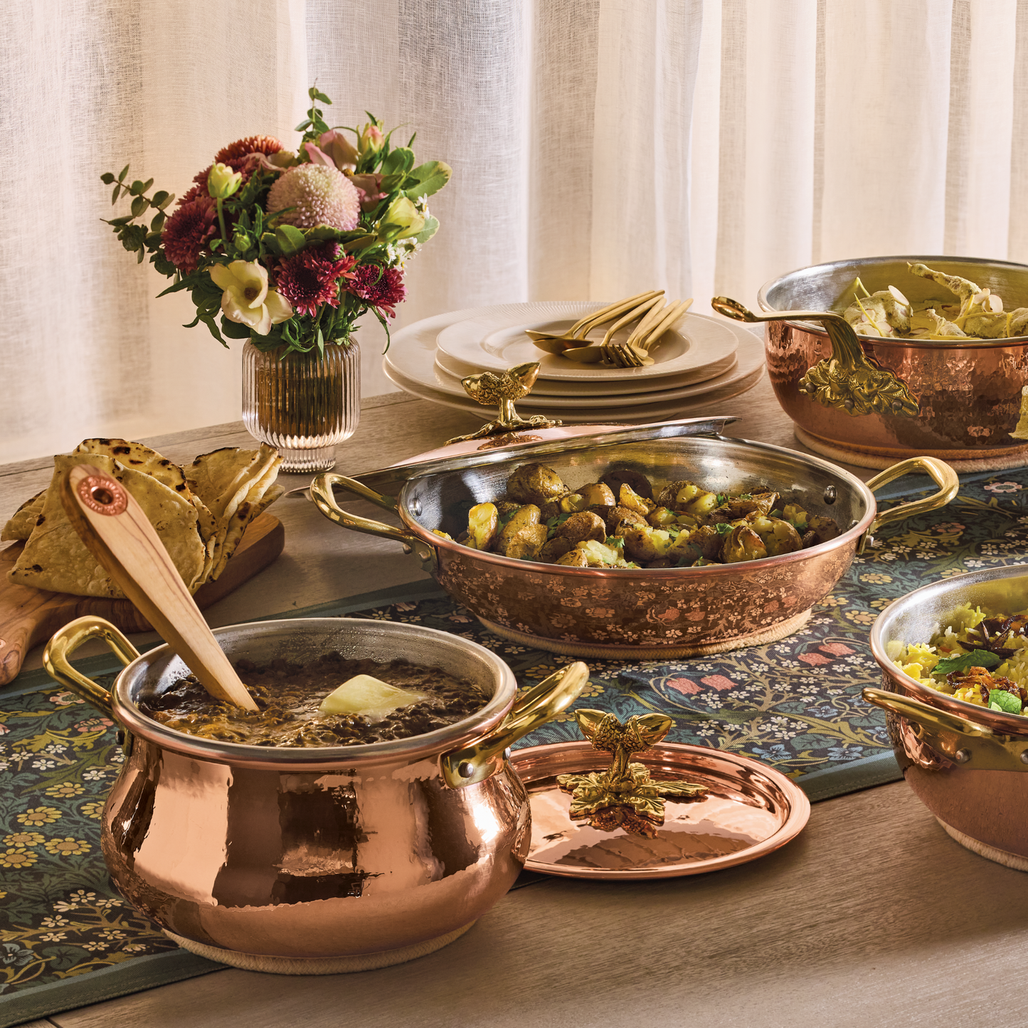 Lunch spread served in hammered copper cookware from the Historia collection