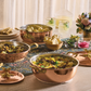 Lunch spread served in hammered copper cookware from the Historia collection