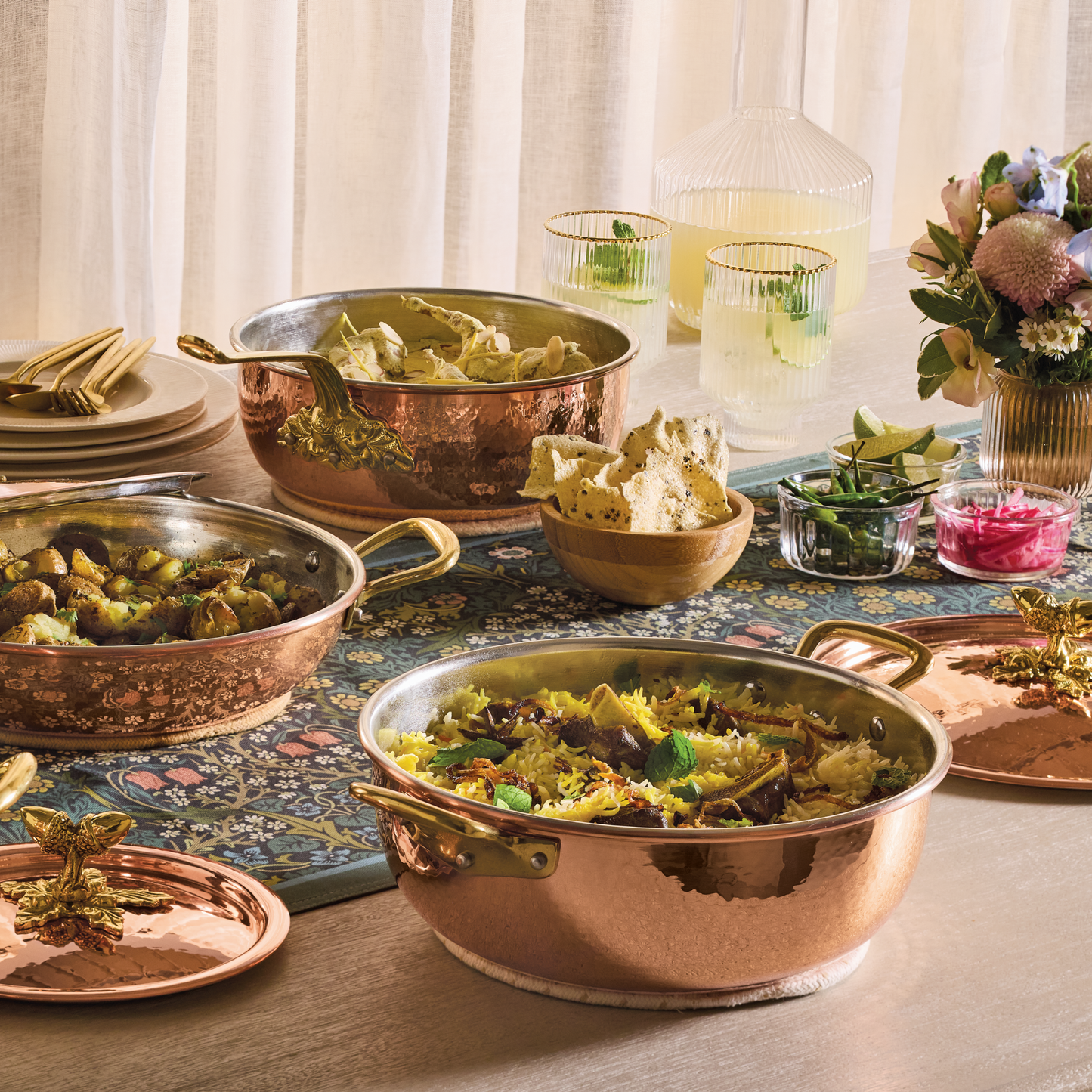 Lunch spread served in hammered copper cookware from the Historia collection