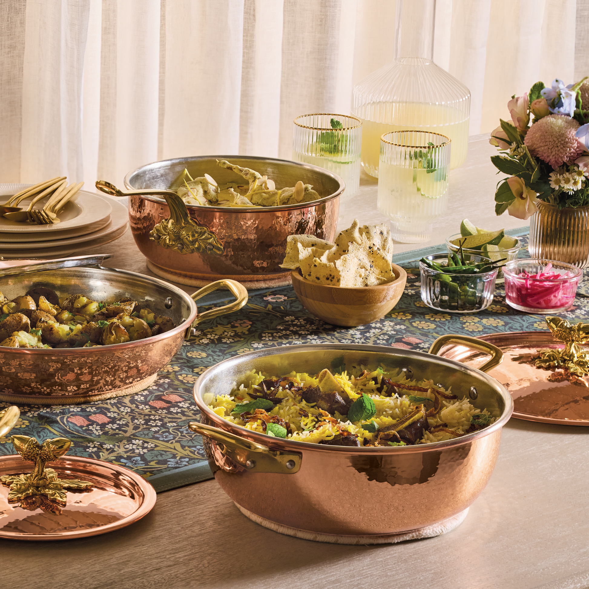 Lunch spread served in hammered copper cookware from the Historia collection