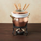 Hammered copper 11 Piece Fondue Michelle Set lined with high purity tin applied by hand over fire and bronze handles, from Ruffoni Historia collection. The full set includes: tin-lined copper fondue pot, porcelain insert, decorative wrought iron stand, gel fuel holder, and six fondue forks.