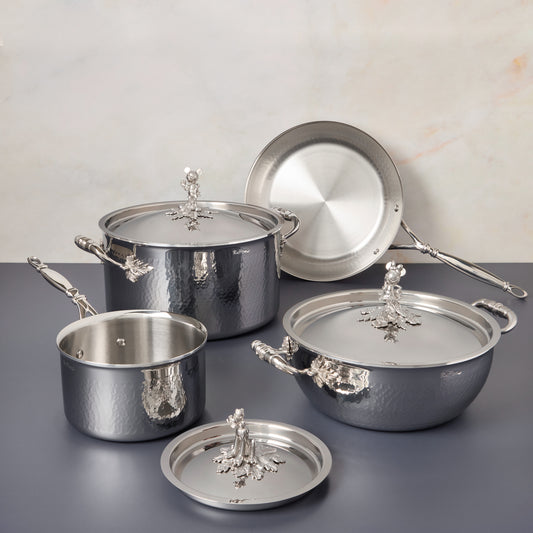 7-piece set Disney x Ruffoni Opus Prima hammered clad stainless steel with special edition Disney-inspired knobs in stainless steel featuring Mickey Mouse, Minnie Mouse, and Pluto by Ruffoni
