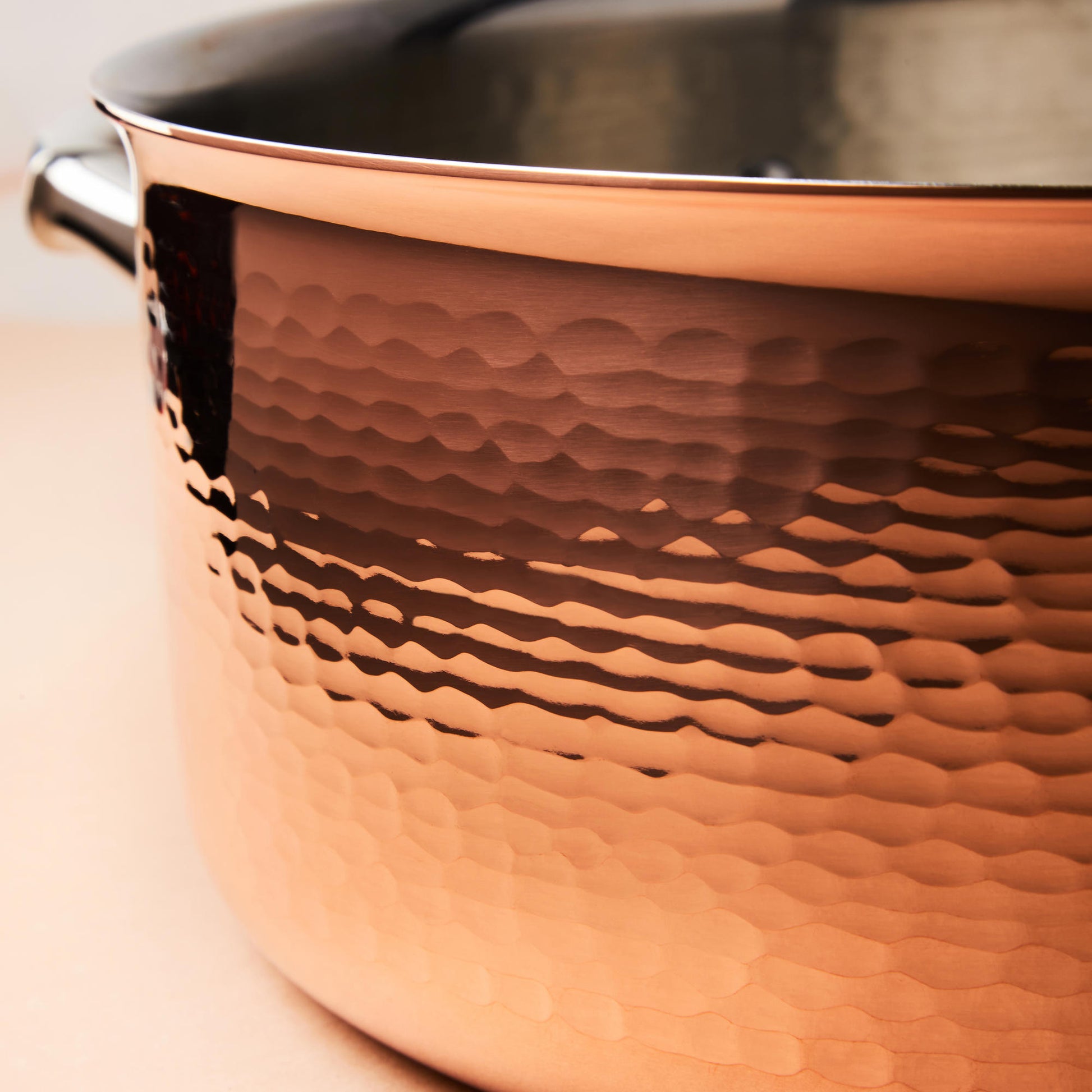 Hammering increases strength and beauty of copper clad with stainless steel cookware from Ruffoni