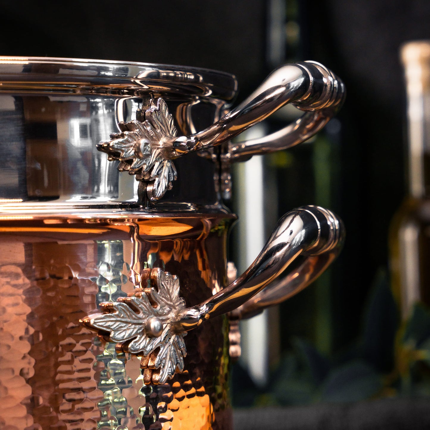  Closeup of the Ruffoni logo on the stainless steel rivet securing the leaf-decorated handle on Stella, part of The Pasta Queen by Ruffoni Collection of Made in Italy cookware