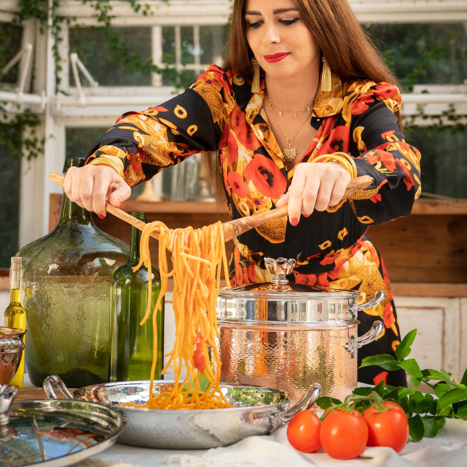 Nadia Caterina Munno, aka The Pasta Queen, presenting spaghetti with cherry tomatoes and basil, made in her Stella, the serving frying pan part of The Pasta Queen by Ruffoni Collection of hammered copper and stainless steel cookware